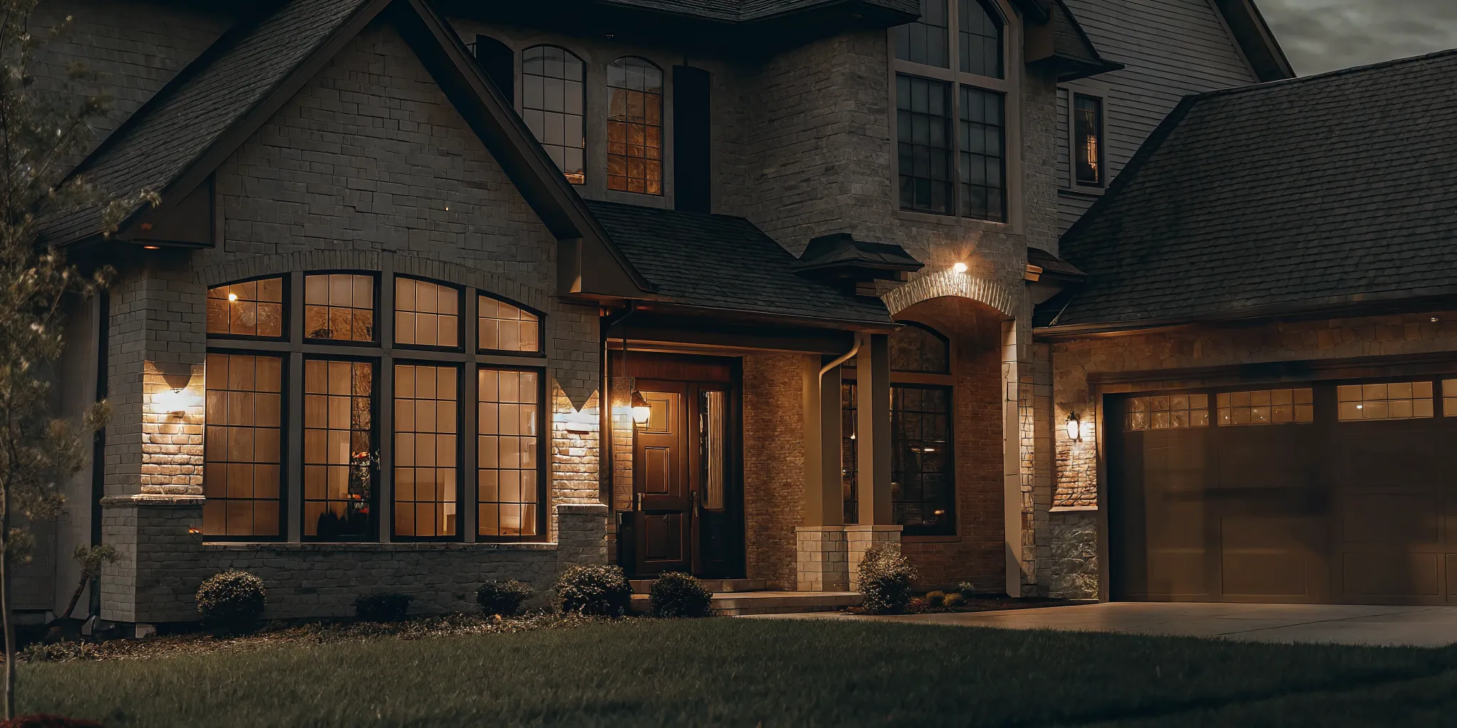 A beautiful residential home in Texas with a Sold sign on the lawn under a sunset sky
